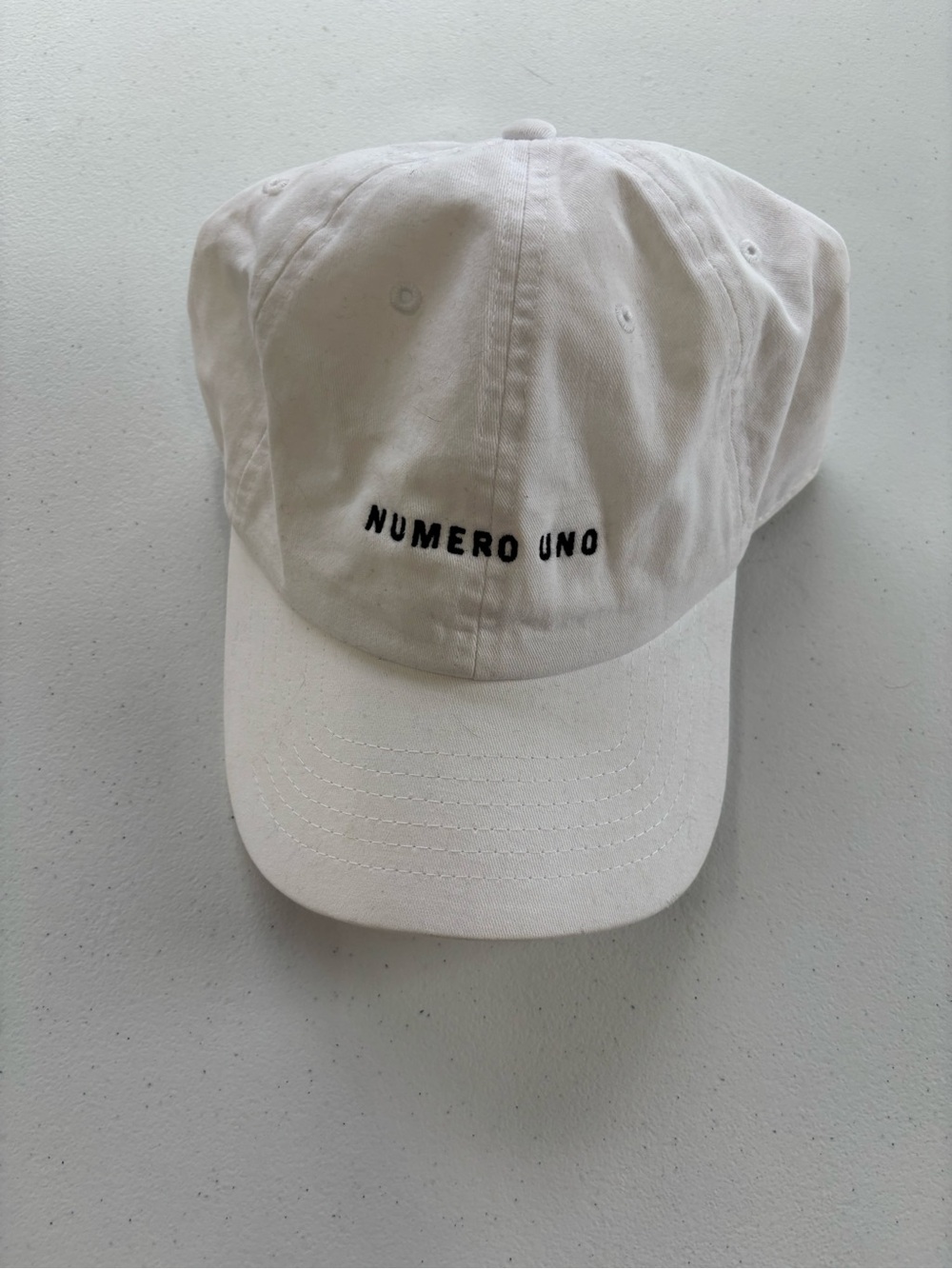 Wembley White Baseball Cap with Black "NUMERO UNO" Embroidery